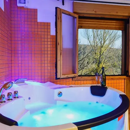 With Jacuzzi And Fireplace In The Riello